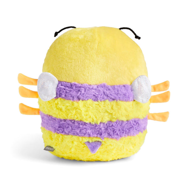Back of a yellow and purple striped fuzzy bee plush toy with black antennae, white circular wings, orange side legs, and small triangle stinger tail photographed on a clean white background.